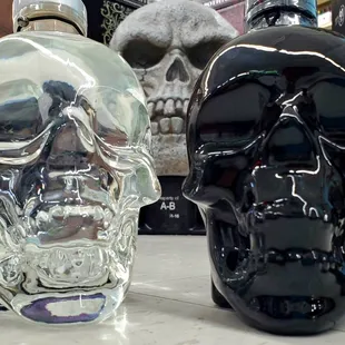 a skull and a black bottle