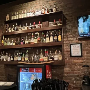 a bar with shelves of liquor