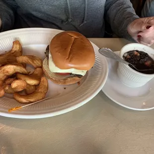 Burger with fries and a side of black beans