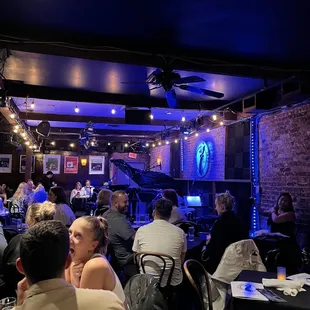 a group of people sitting at tables