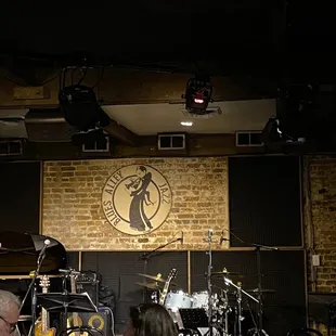 a man and a woman sitting at a piano