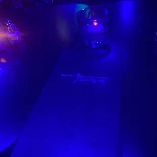 a bar with blue lighting