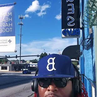a man wearing a baseball uniform and headphones