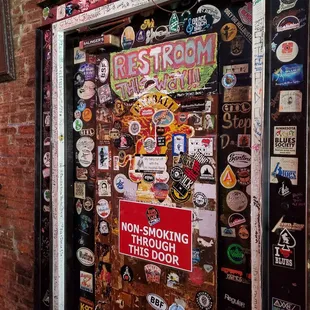 a door covered in stickers