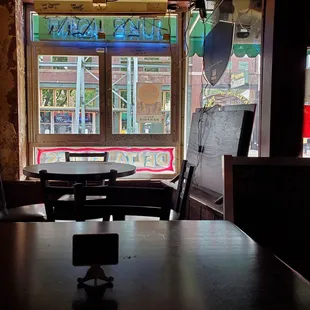 a table and chairs in front of a window