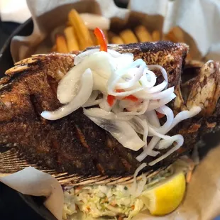 grilled fish with onions and coleslaw