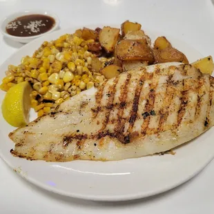 grilled fish with potatoes and corn
