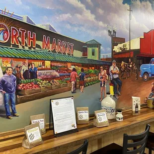 a mural of a farmers market