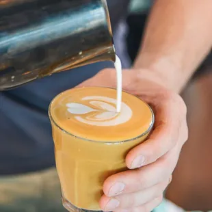 a person pouring a drink