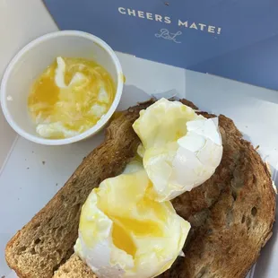 a piece of toast with an egg on top