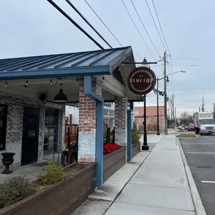 a brick building with a sign for a restaurant