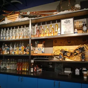 a shelf of liquor bottles