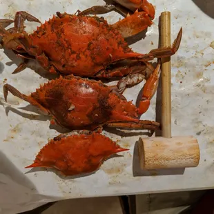three crabs on a cutting board