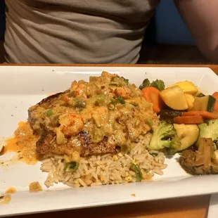 Mahi mahi with shrimp rice and veggies.