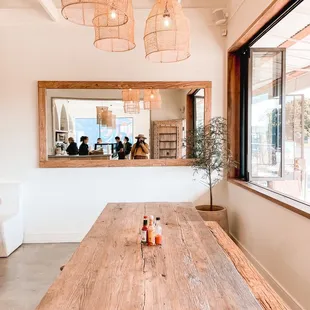 a dining room with a large wooden table