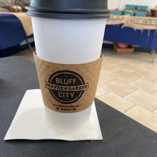 Seating inside with selection of baked goods and vegetables.