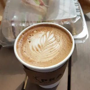 Turkey club sandwich... in the background with a cup of coffee from Prairie Espresso in front of it. I recommend both places for lunch!