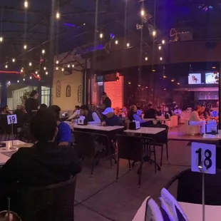 people sitting at tables with laptops