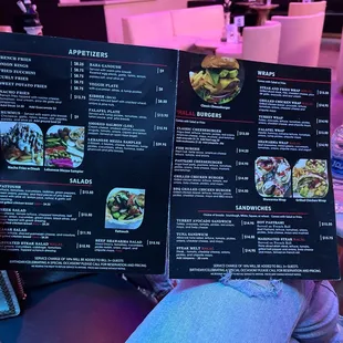 a person holding a menu