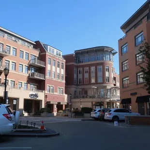 View of the upper of two levels of parking for The Shops of Uptown strip mall.