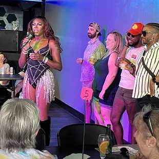 Autumn announcing the rules of the booty bumpin activity to earn a shot.