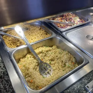 food being prepared in a buffet