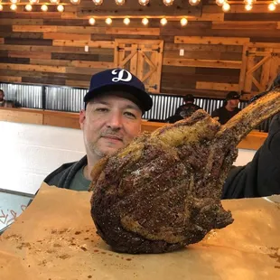 DFW's largest Tomahawk Beef Ribs at Blu's Barbeque. Smoked to perfection.