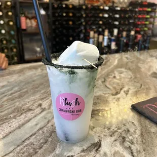 a frozen drink in a glass with a straw