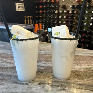 two cocktails on a marble table