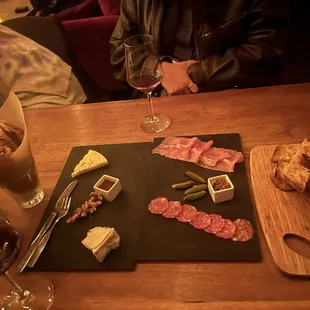 Cheese/charcuterie board, sardines, Malbec