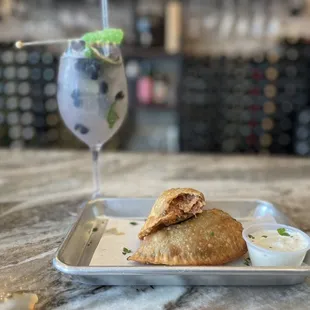 Blueberry lavender mojito and crab empanadas