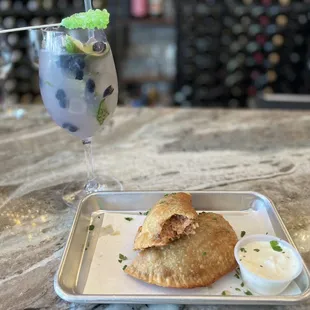 Blueberry lavender mojito and crab empanadas