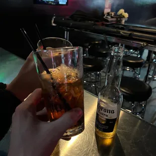 a person holding a drink