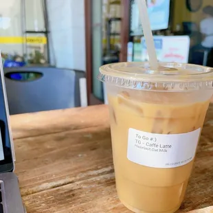 a cup of iced coffee on a table