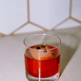 a red drink in a glass
