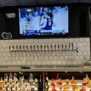 a bar with a television on the wall