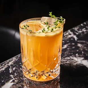 a drink in a glass on a table