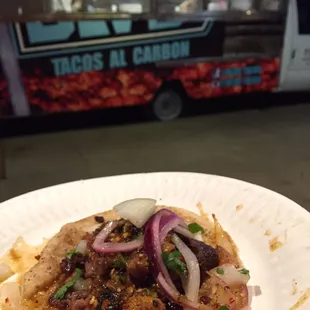 a taco on a paper plate