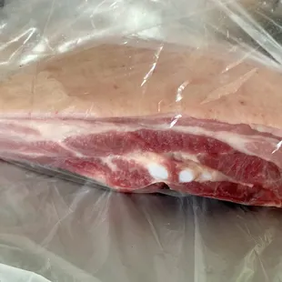 Close of pork belly slab (bone in)