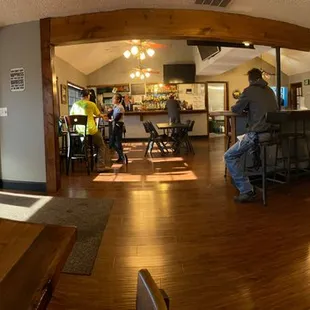 Sitting at the tables on the south wall, you can see the entrance (left) and the main dining area.