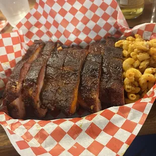 Half slab plus Mac n cheese!!! Meat falls right out of the bone. Plenty of room with TVs and high tops owners wife is a great server.