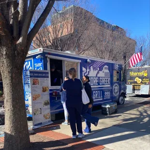 a food truck parked on the side of the road