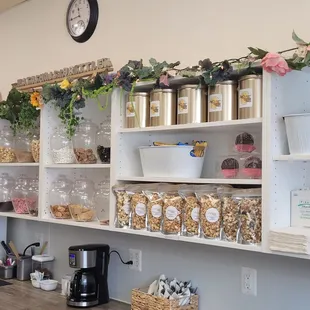 a kitchen with a counter and shelves