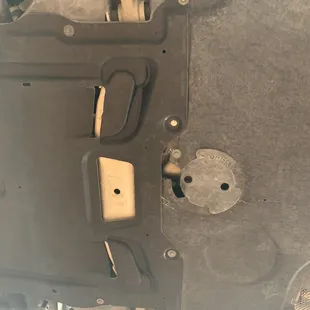 Damage to the skid plate that was scraping. (Picture taken after bringing it back to be &quot;fixed&quot;)