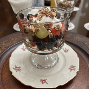 Fruit, yogurt, and granola as part of breakfast