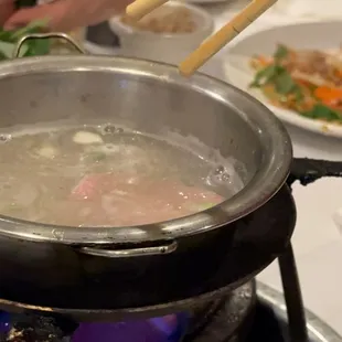 a pot of soup on a stove