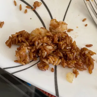 a plate of rice and a fork