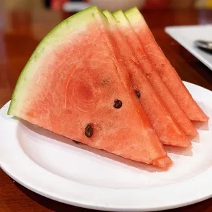 Complimentary watermelon slices for dessert.