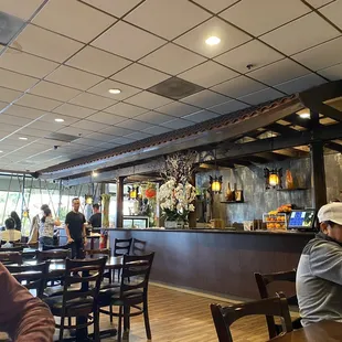 Brisk takeout counter and large cashier area.