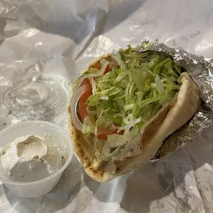 Gyro!!! Plenty of meat below, don&apos;t worry. Great pita and sauce.